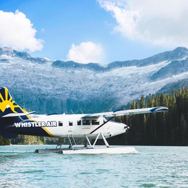 Floatplane takeoff over a glacier‑fed Whistler lake.