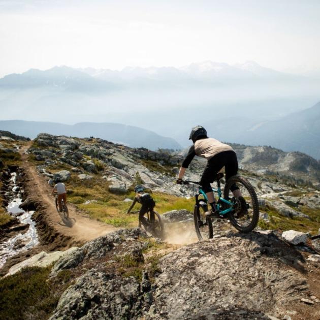 Heli‑access mountain biking on a remote Whistler ridge.
